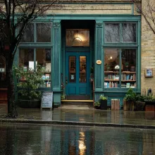 viewing the doorway to an old bookstore on a rainy day